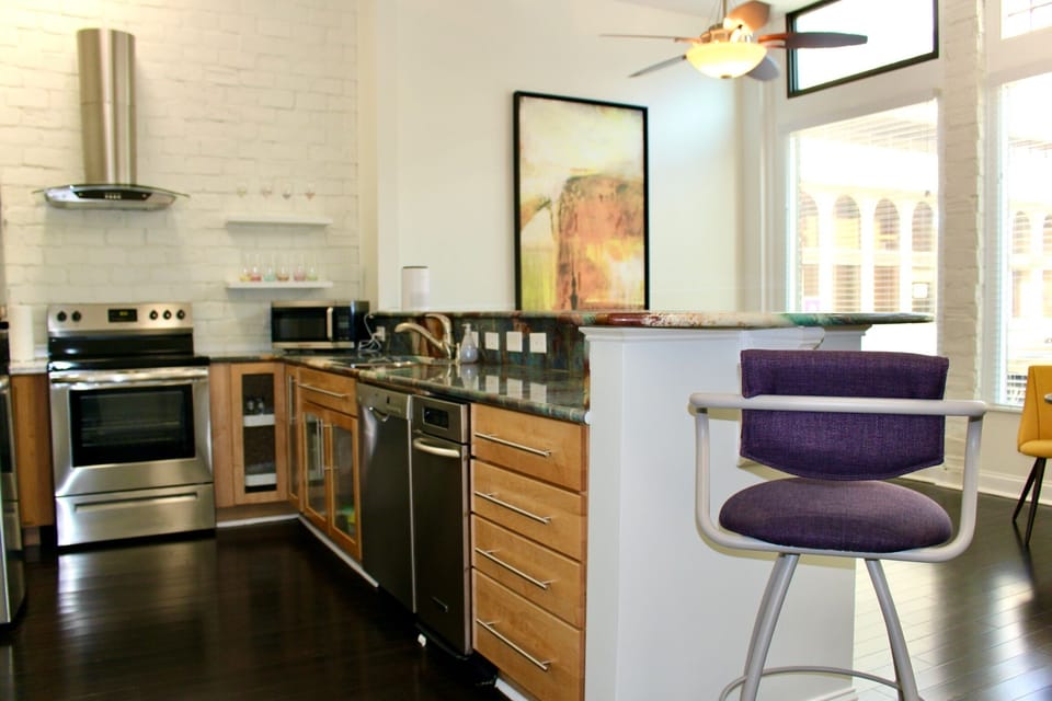 Open kitchen to living room/TV area.
