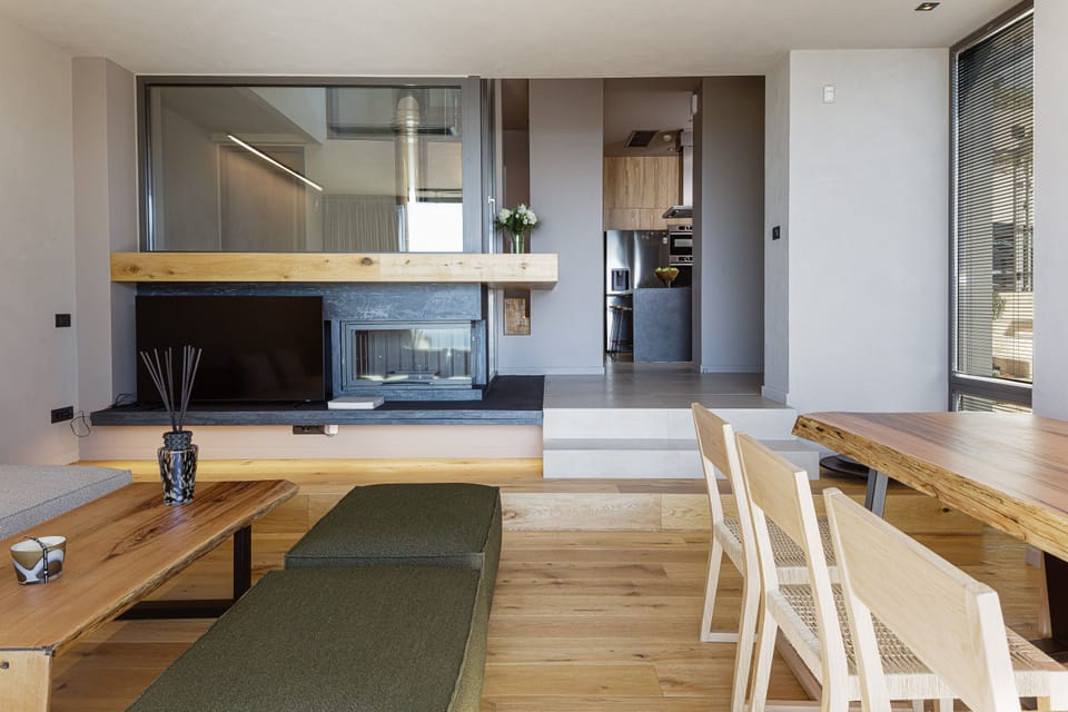 The effortlessly chic and luminous lounge area wraps around the modern fireplace!