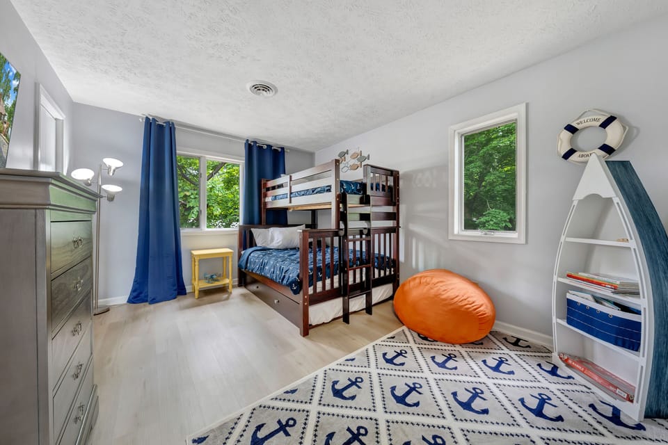 Upper level bedroom with bunk beds.