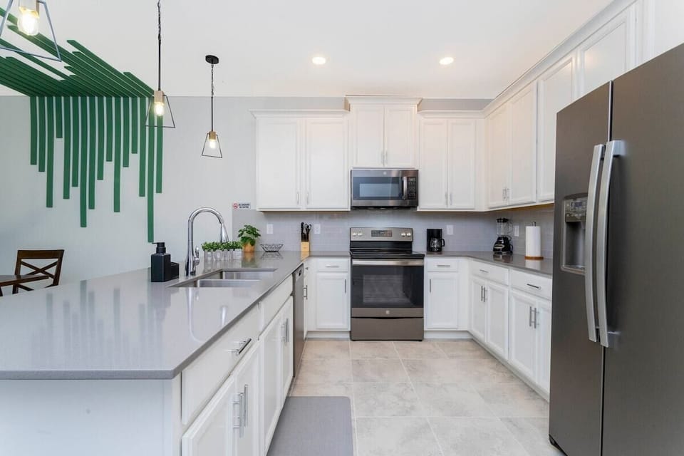 A full equipped and comfortable kitchen ready for family gatherings where you can feel as cozy as home.
