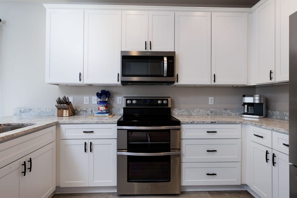 new stainless steel appliances, double oven,coffee maker, spices, utensils etc. 