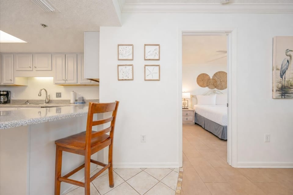 Cook and gather in this kitchen, featuring stainless appliances and ample counter space for meal preparation