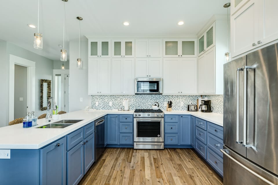 Chef's kitchen with stainless steel appliances & French door refrigerator