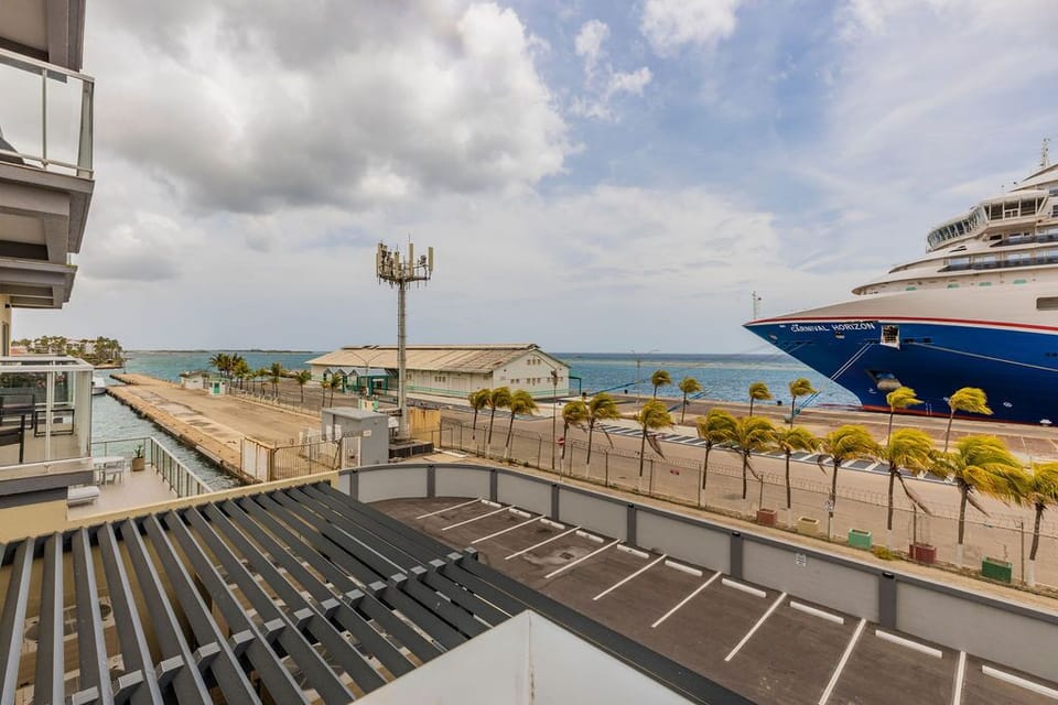 Stay energized with a fully equipped workout space featuring free weights, cardio equipment, and an inspiring ocean view to motivate your fitness routine.