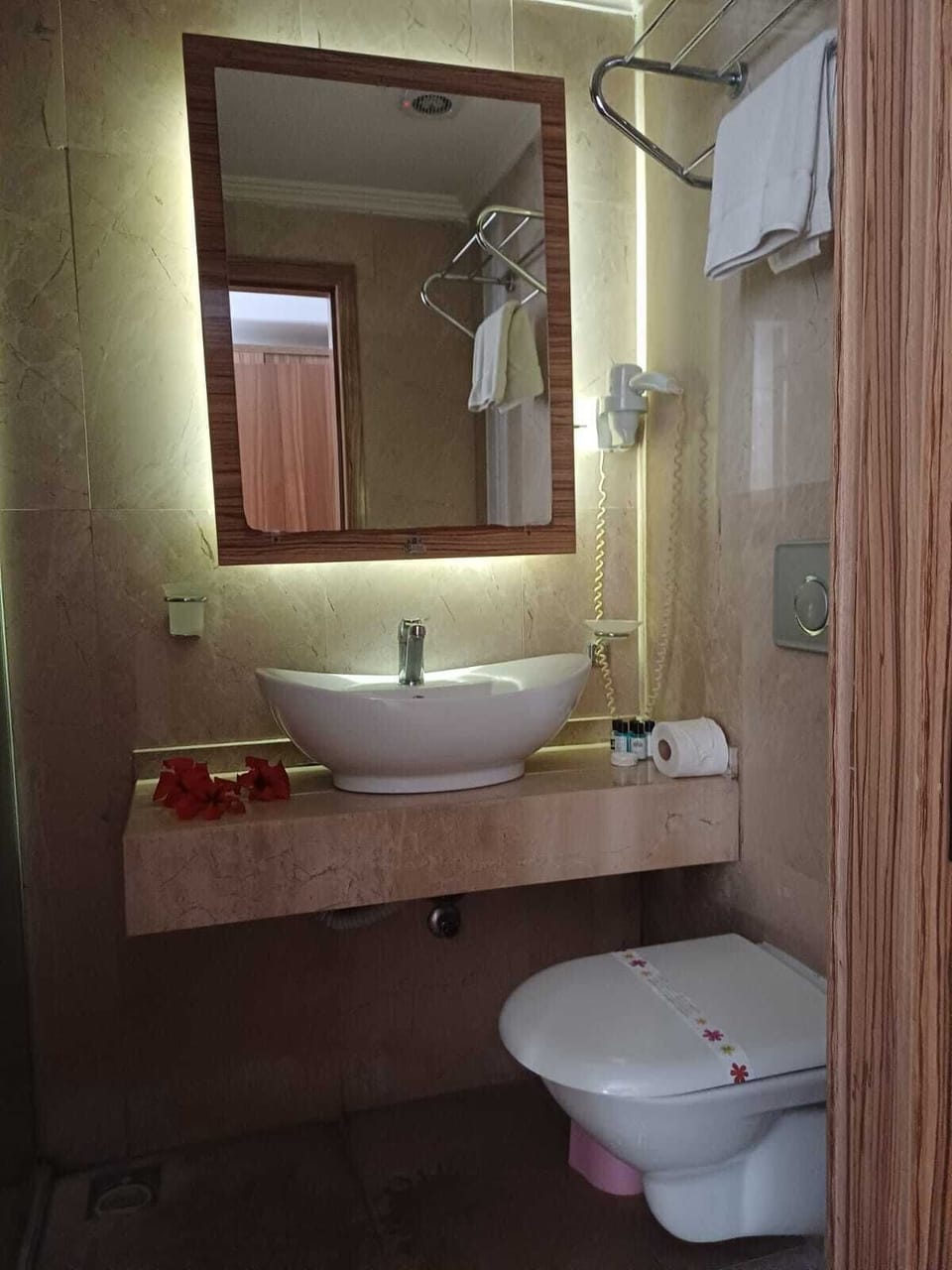 Shower, hair dryer, slippers, towels