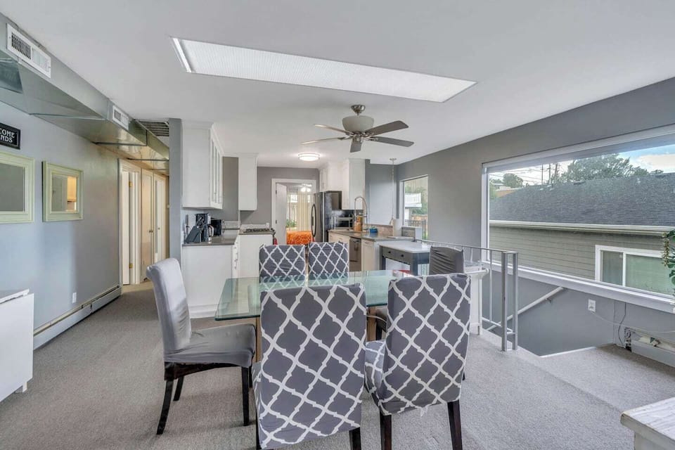 Upper level dining and kitchen area.  Lots of seating for lots of guests.