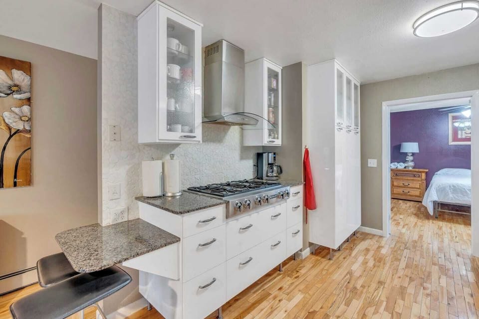 Main level kitchen with dishwasher, oven, stove top, full sized refrigerator.  Fully equipped with pots, pans, dishes, silverware, coffee maker, toaster, blender, mixer, kitchen gadgets, everything you will need.