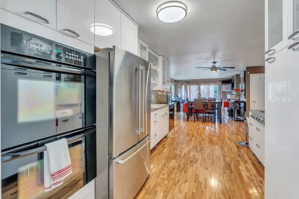 Main level kitchen with dishwasher, oven, stove top, full sized refrigerator.  Fully equipped with pots, pans, dishes, silverware, coffee maker, toaster, blender, mixer, kitchen gadgets, everything you will need.
