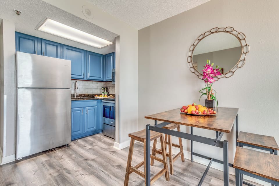 Experience the elegance of an open-concept kitchen in our suite, where stylish design seamlessly merges with functionality to create a sophisticated cooking space.