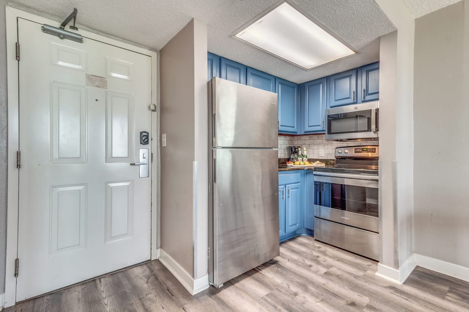Experience the elegance of an open-concept kitchen in our suite, where stylish design seamlessly merges with functionality to create a sophisticated cooking space.