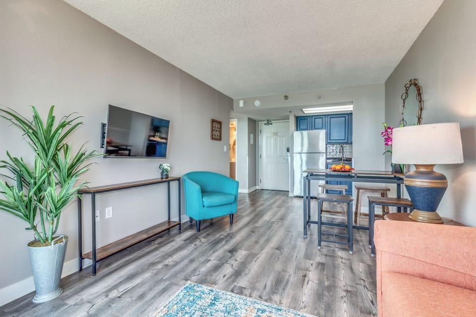 Make our suite's living area your entertainment centerpiece, with a high-quality TV taking center stage amidst chic decor and comfortable seating.