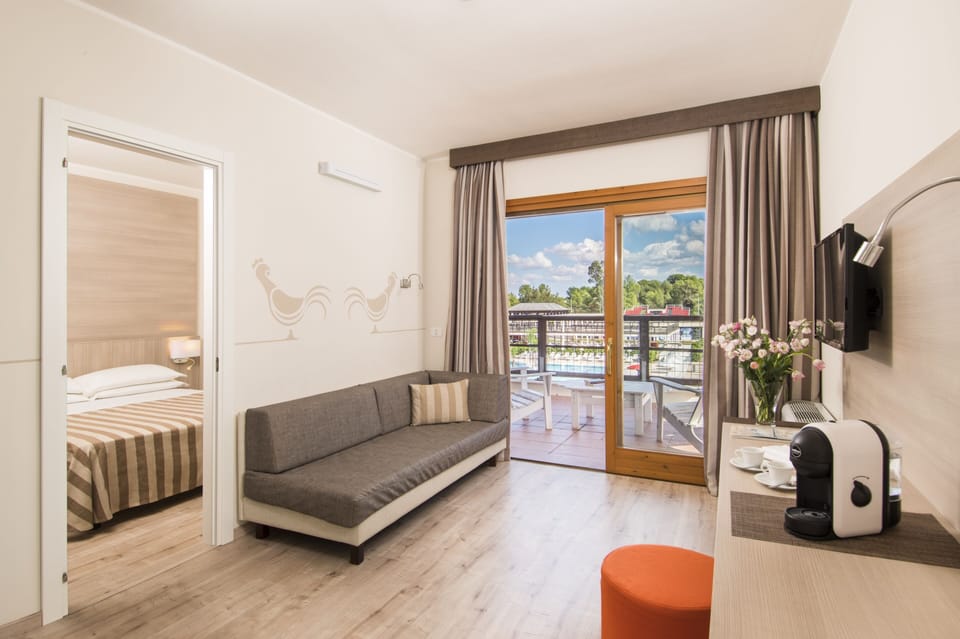 In-room safe, desk, laptop workspace, bed sheets