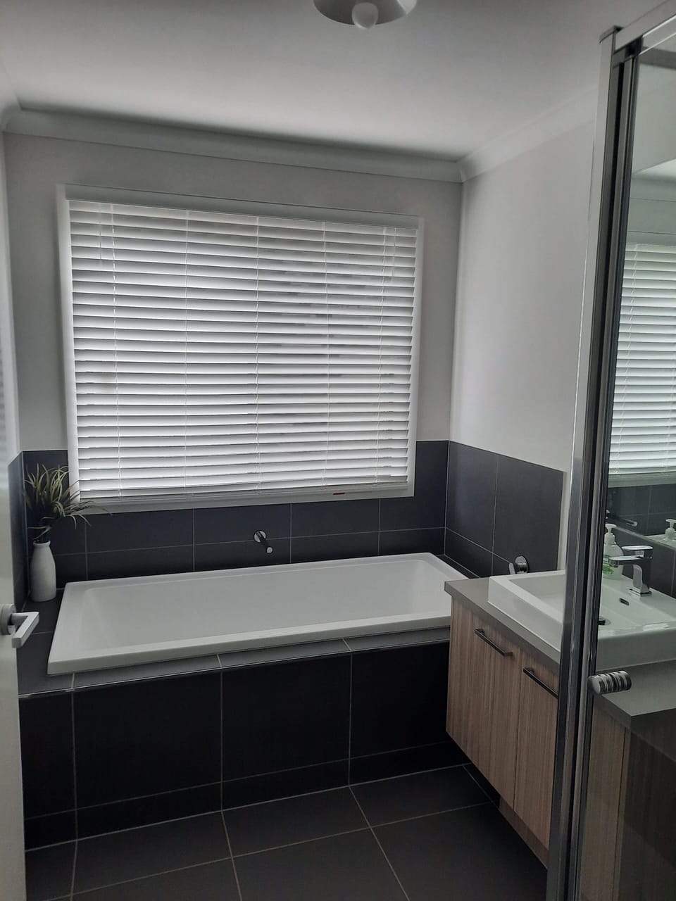 shared bathroom with bath and shower