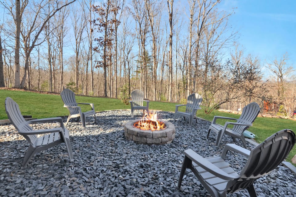 Lower level patio with large hot tub and fire pit