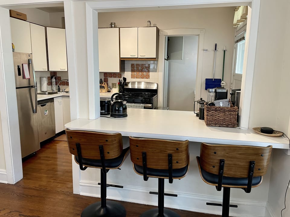 Connected dining room & kitchen with countertop seating