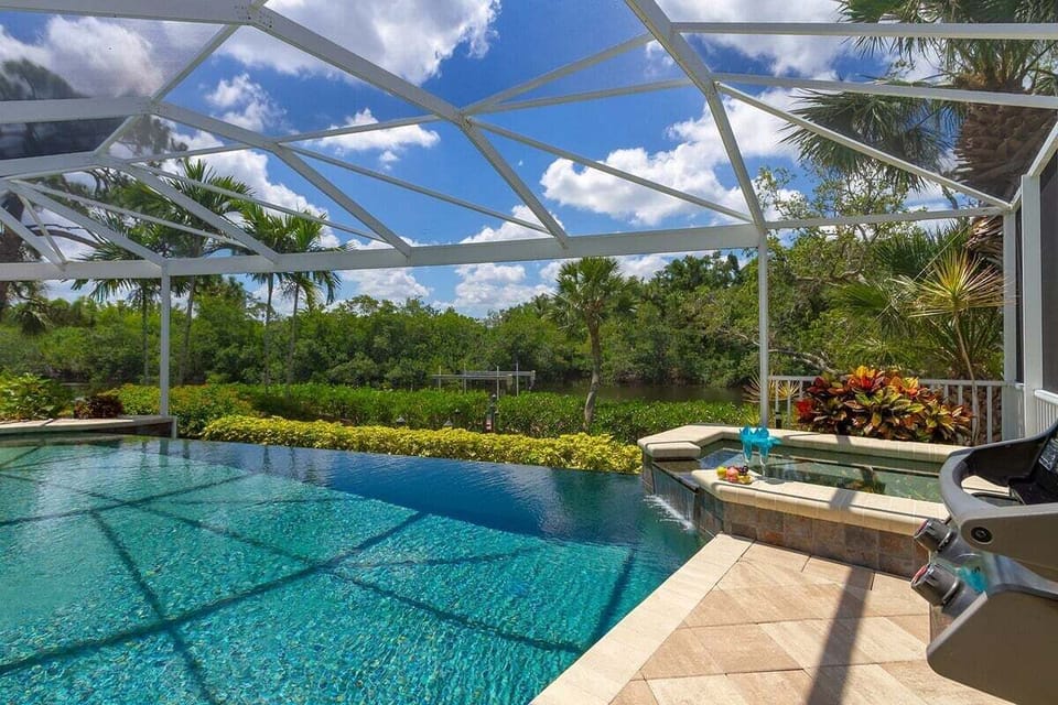 Infinity Edge Pool with Overflow Waterfall and Hot Tub