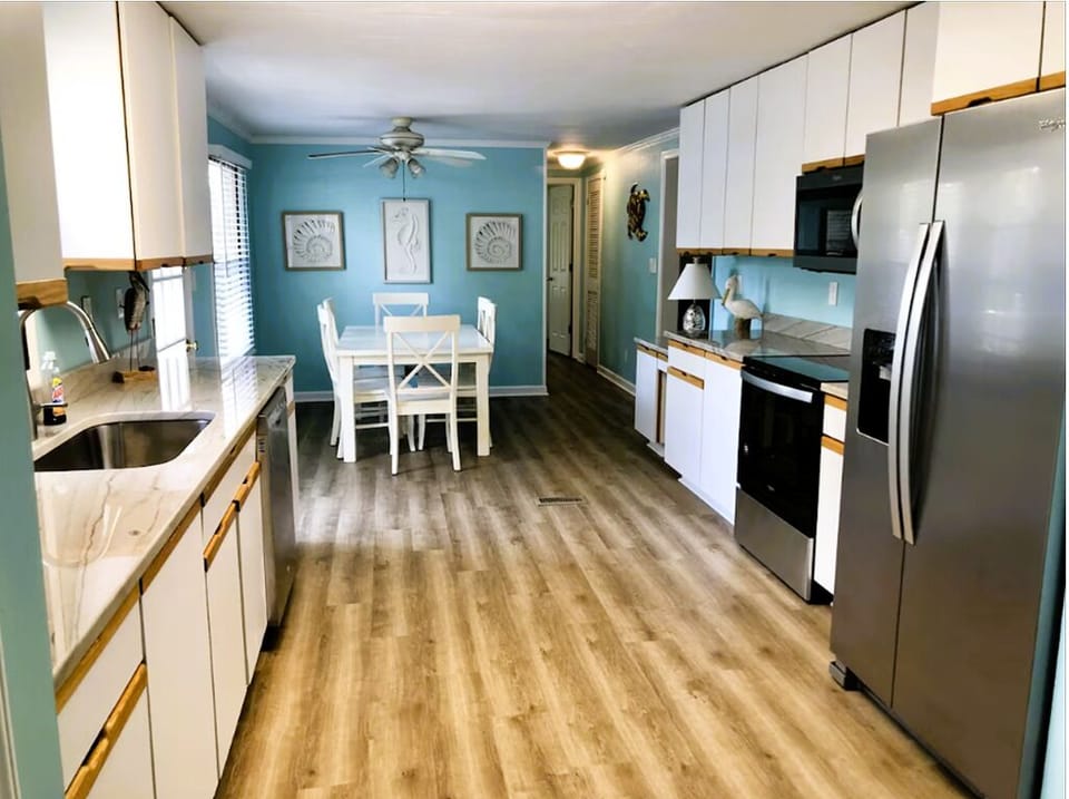 Renovated 2020. New flooring, appliances, & kitchen opened up with tons of space