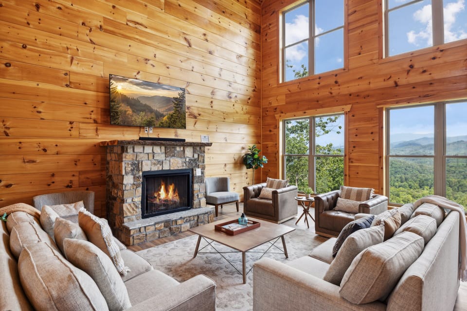 Unwind by the fireplace after a long day of exploring top local attractions in Gatlinburg, Pigeon Forge, and Townsend | Oakley Lodge in Sevierville, TN | Family Cabin Rental