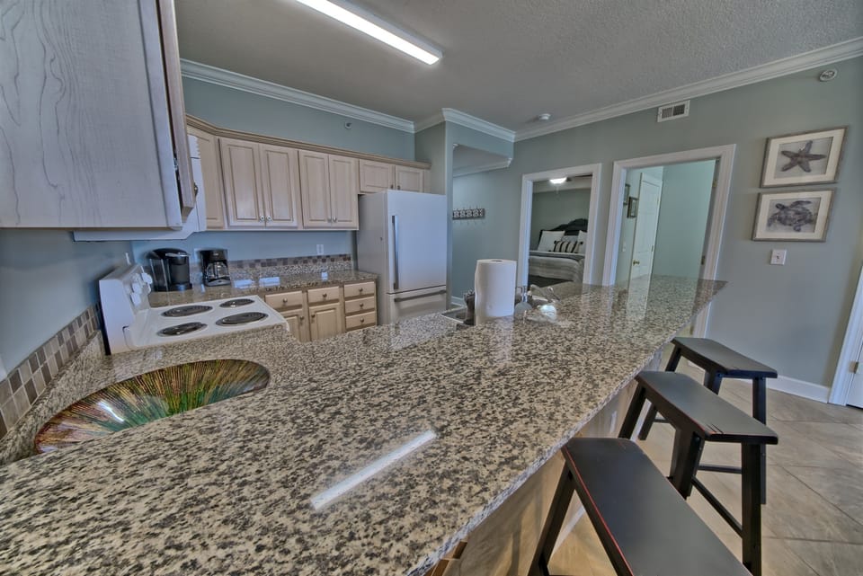 Enjoy family gatherings in the kitchen while sitting at the bar
