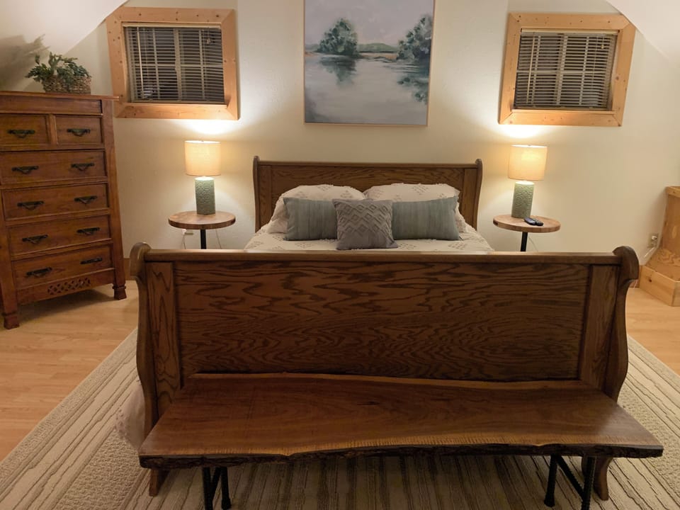 This is the upstairs master bedroom with a queen-sized bed.