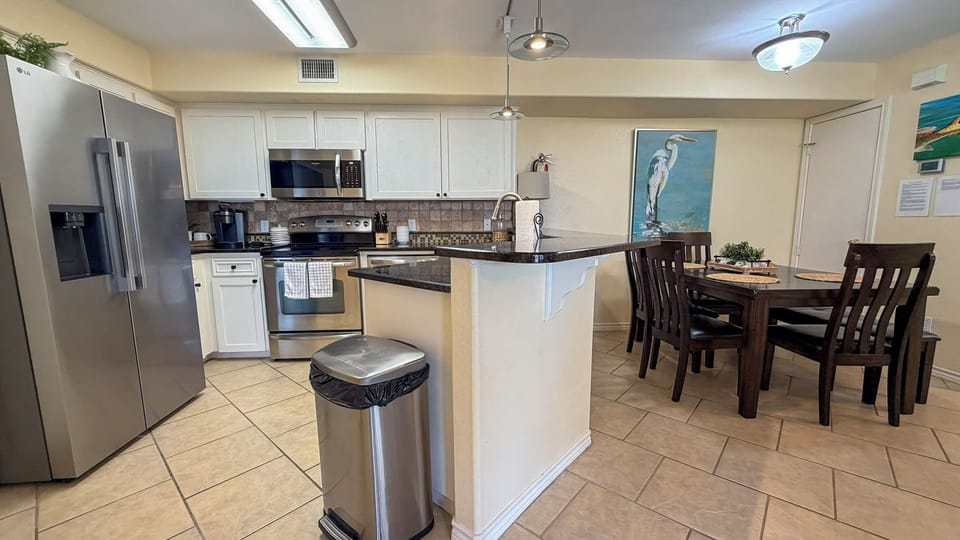 Your fully equipped kitchen features stainless steel appliances and granite countertops, perfect for preparing meals during your stay.