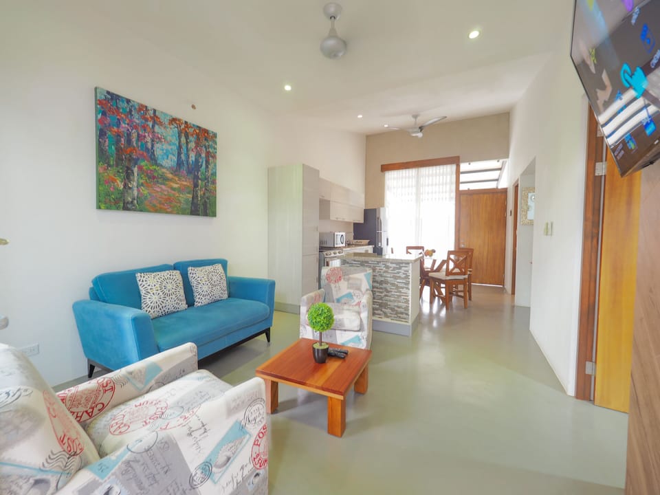 Deluxe Condo | Living area | TV