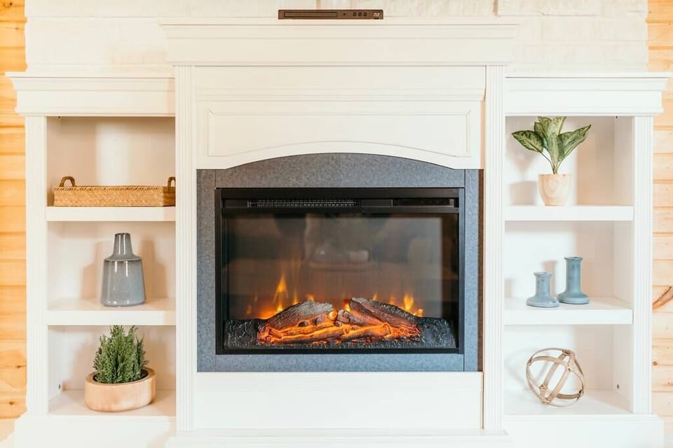 Electric fireplace that provides additional heat