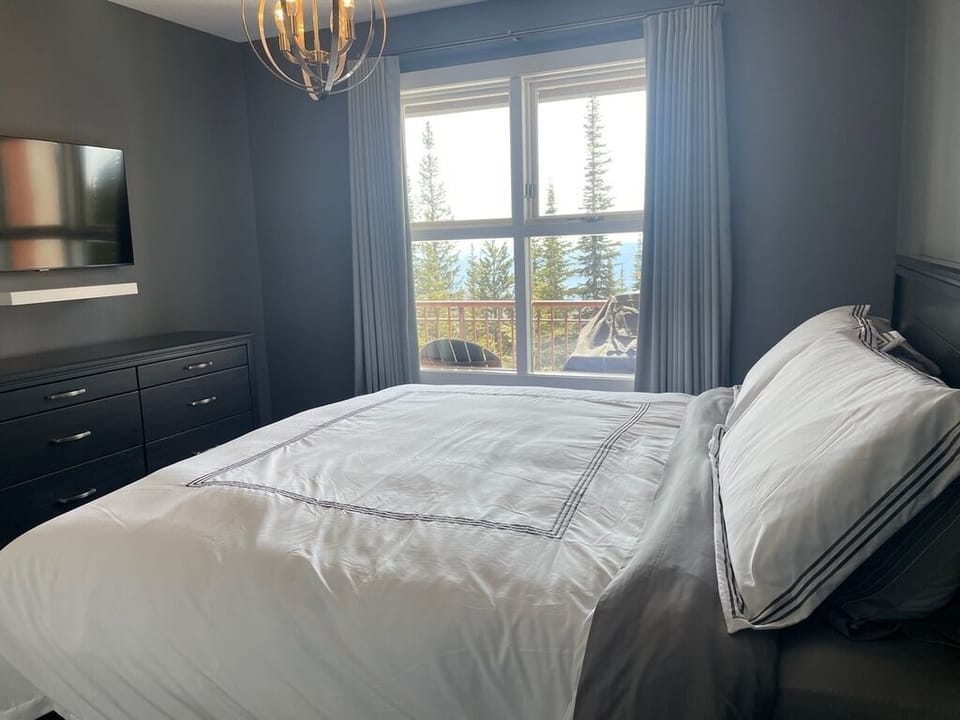 Master Bedroom with King Bed and Flat Screen Tv
