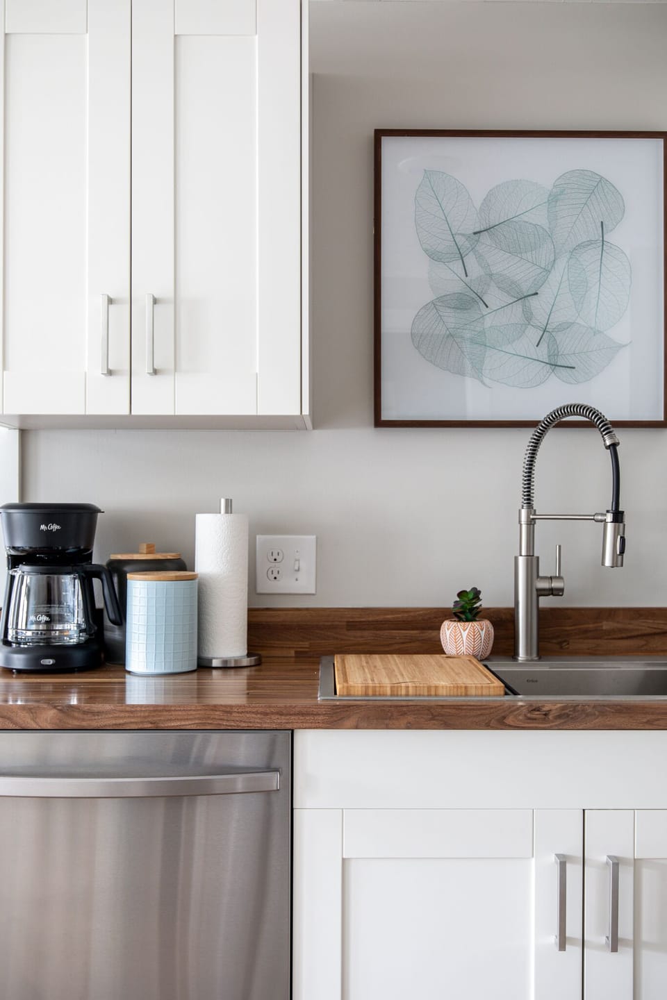 Coffee station w/ drip maker, mugs & counter space to start your morning right.