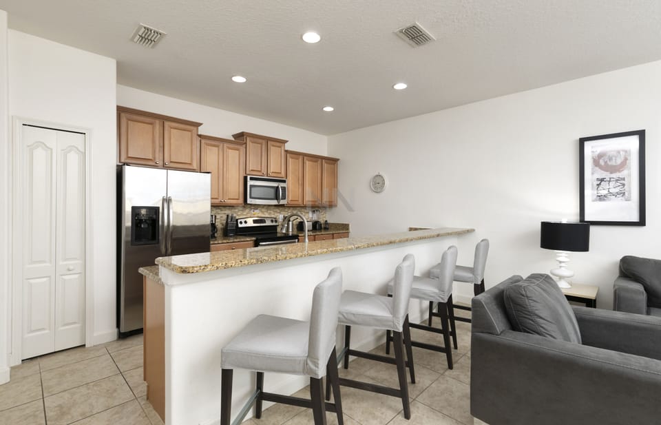 Cook up a storm in our fully equipped kitchen with counter seating.