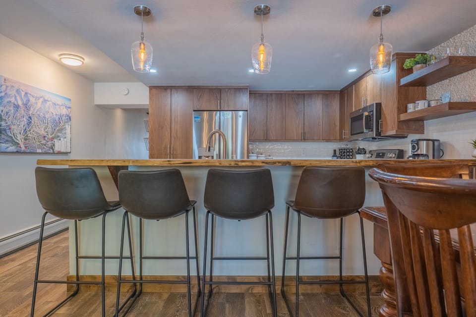 Bar seating overlooks the kitchen