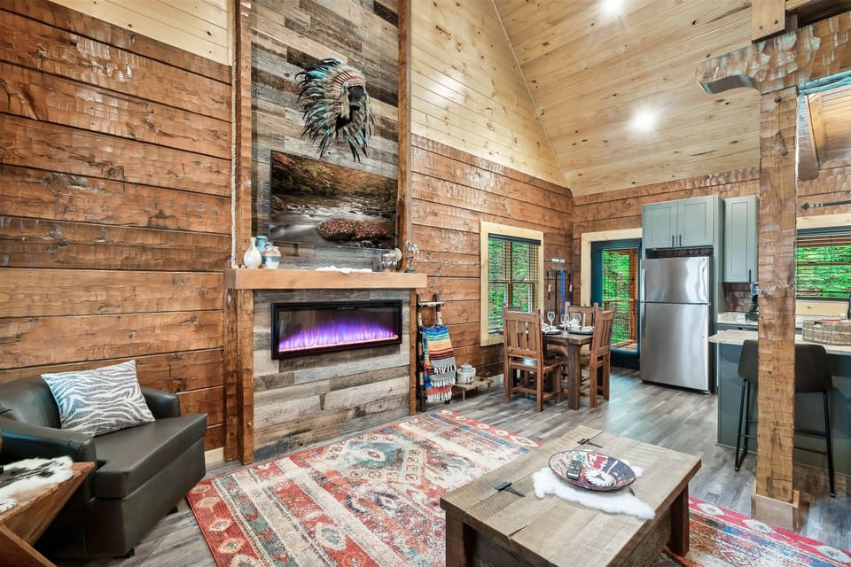 This cozy living room invites you in with a queen size sleeper sofa, and electric fireplace for year-round ambiance.
