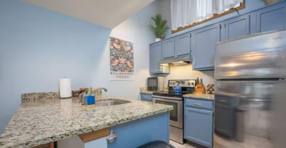 Kitchen featuring stainless steel appliances and granite countertops.