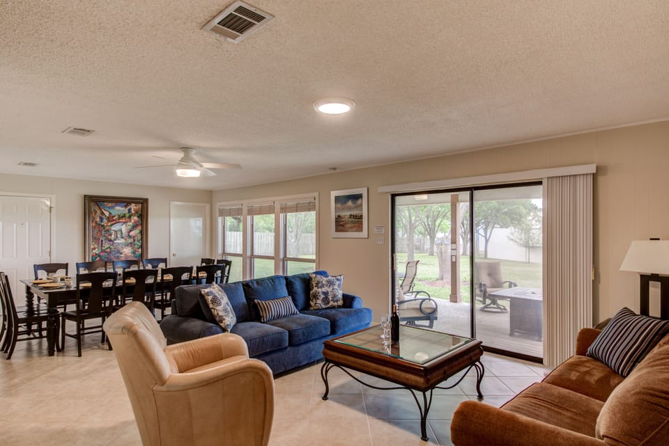 Living room and dining area with tile flooring throughout