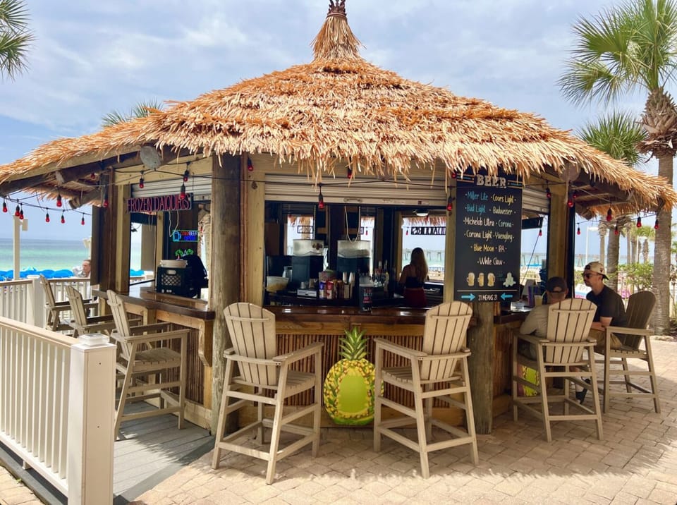 Grab a refreshing drink at the Tiki Hut which is located near pools!