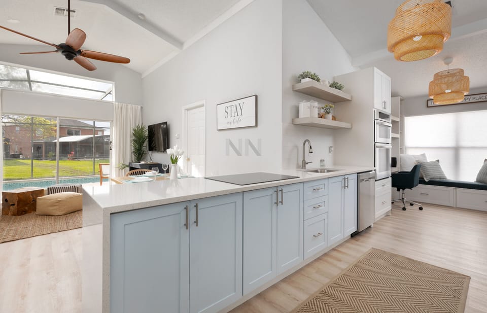 Enjoy the kitchen countertop's stunning view of the living room.