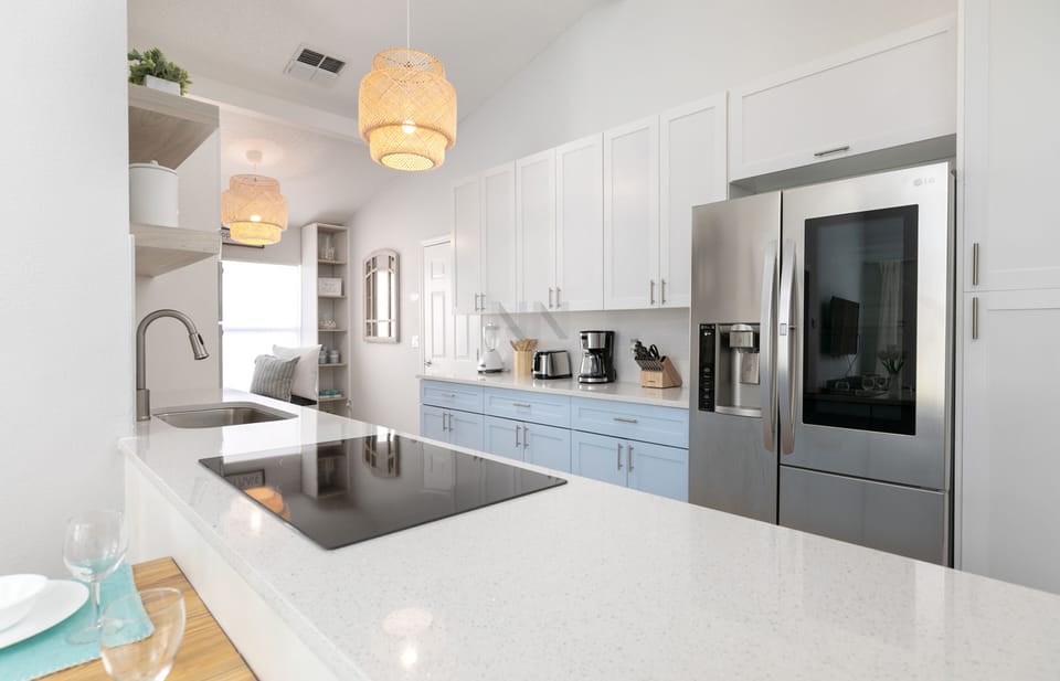Cook with ease in the beautiful kitchen with a modern cooktop.
