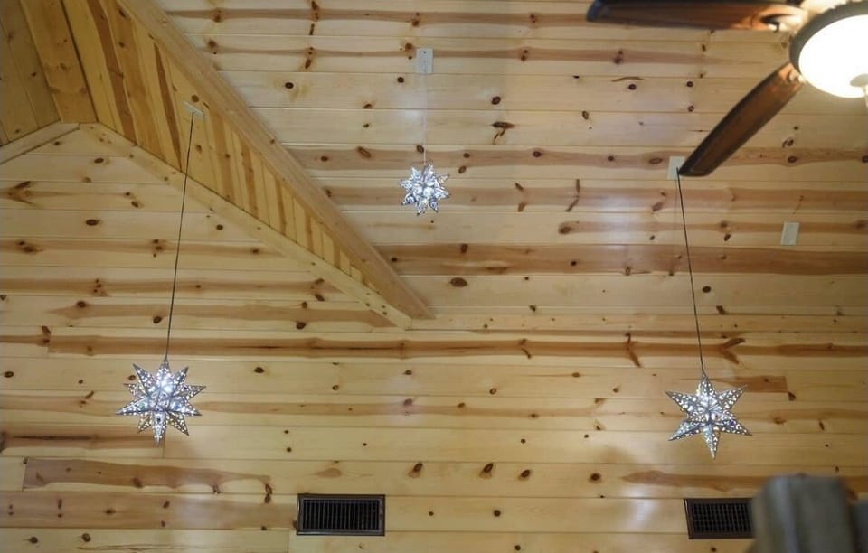 Cozy meets cosmic with glowing & starry roof decor.