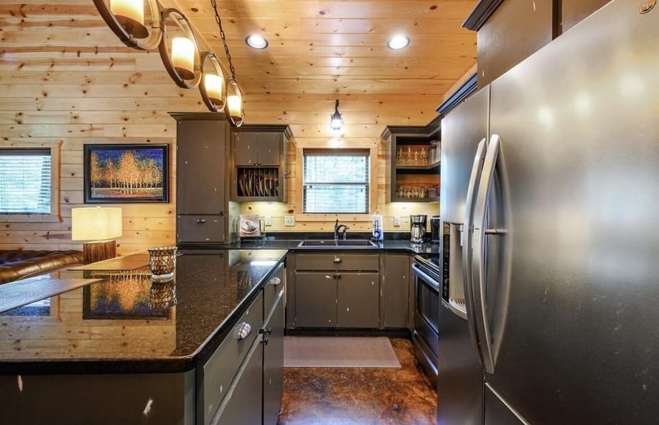 Spacious kitchen with full-size fridge & essentials.