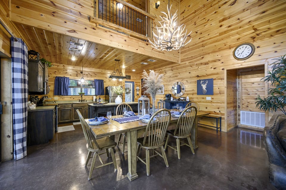 Dining room table with a view into the kitchen and Master bedroom entrance
