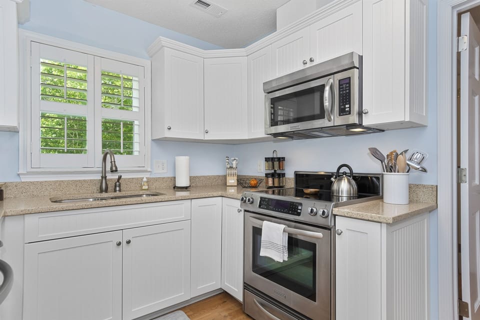 The kitchen is equipped with high quality stainless steel Kitchen Aid appliances.