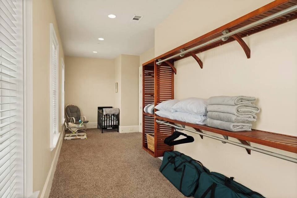 Nursery area equipped with a crib, rocking chair and walker.

Four full size - XL Cots fitting up to 6'4 and 300 pounds. Extra blankets and pillows. 