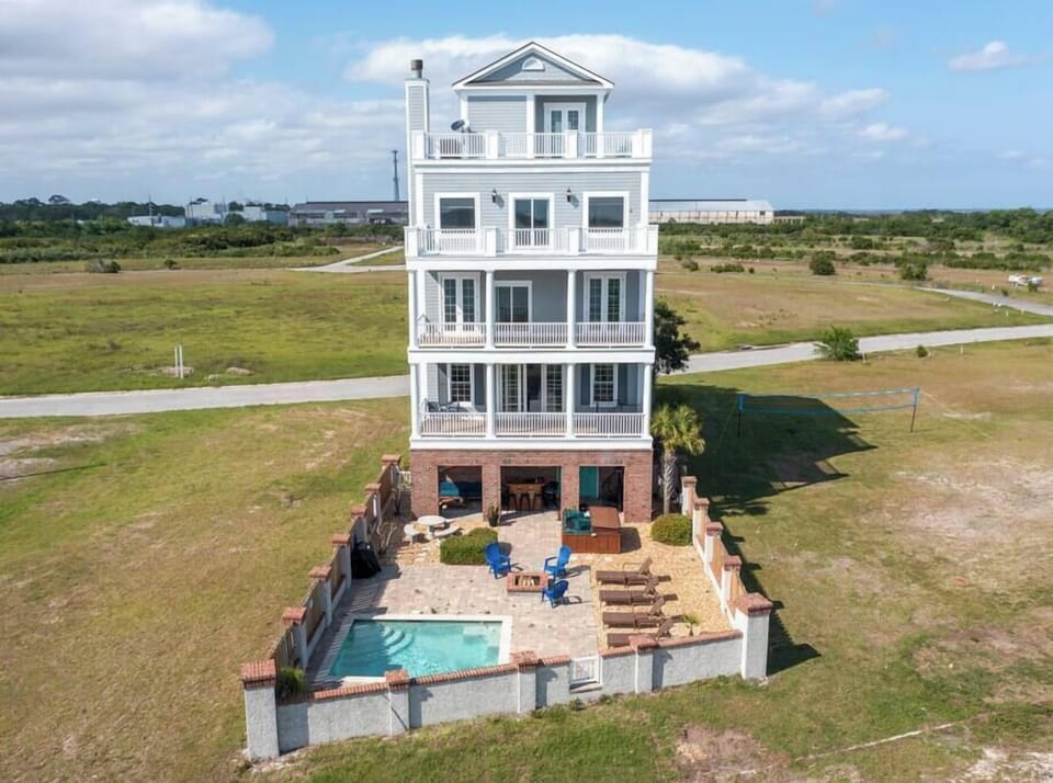 Pool, fire pit, hot tub, tiki bar, outdoor grilling and dining, decks on every level - what else could you ask for?