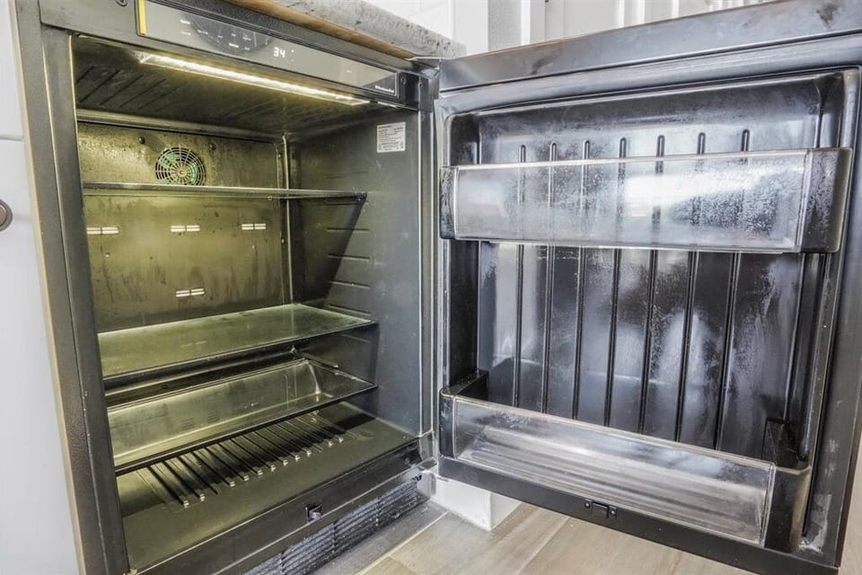 Built in mini fridge in coffee bar area!