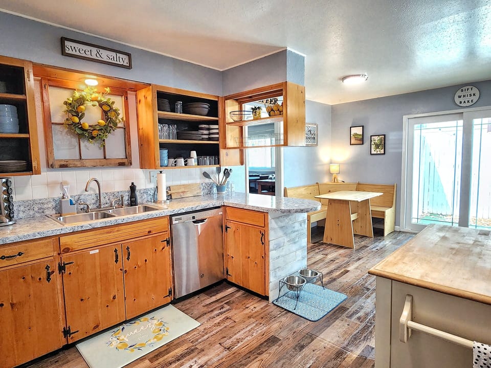 Kitchen has: dishwasher, oven/stove, fridge/freezer, coffee makers & microwave.