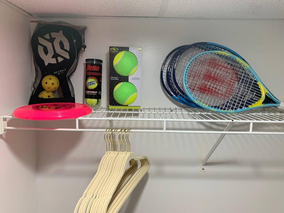 Tennis and pickleball supplies along with a frisbee for playing at the beach!