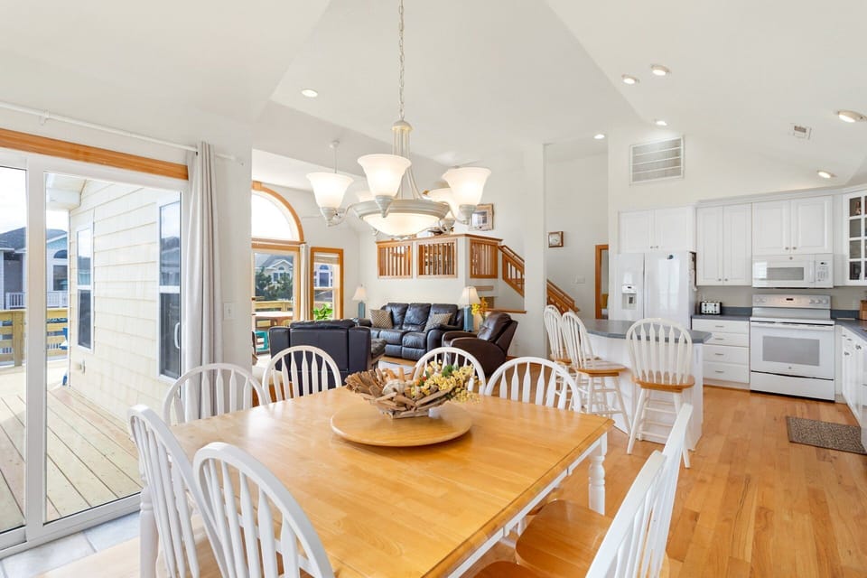 Top-Level Dining Area: Dining space with seating for six plus four bar chairs at the kitchen island.