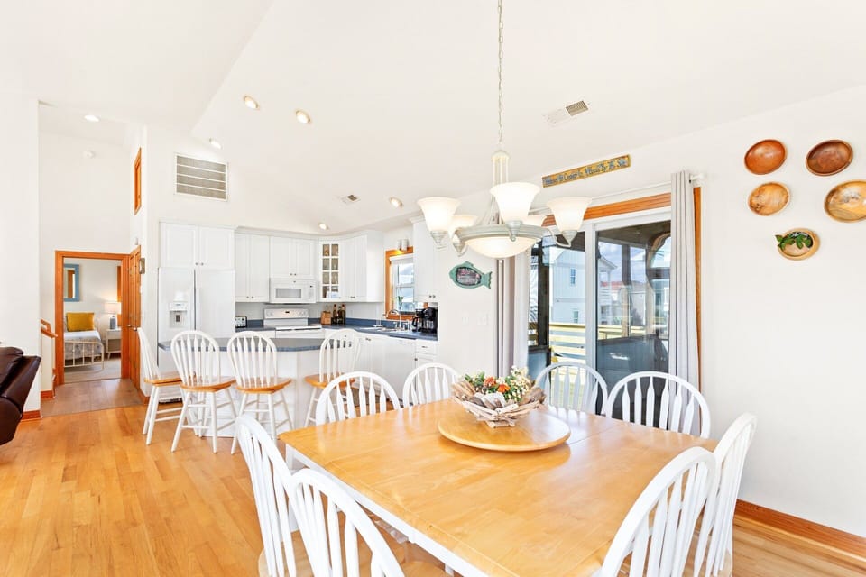 Top-Level Dining Area: Dining space with seating for six plus four bar chairs at the kitchen island.