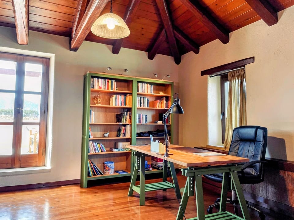 Curl up with a good book in our soothing home library hideaway.