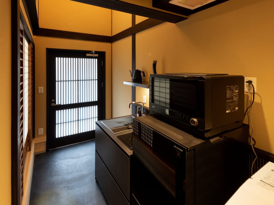 Villa | Private kitchen | Fridge, microwave, stovetop, griddle